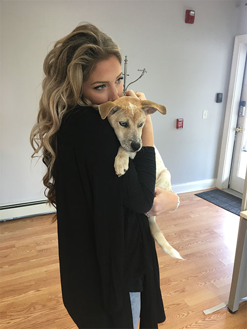 Woman holding dog